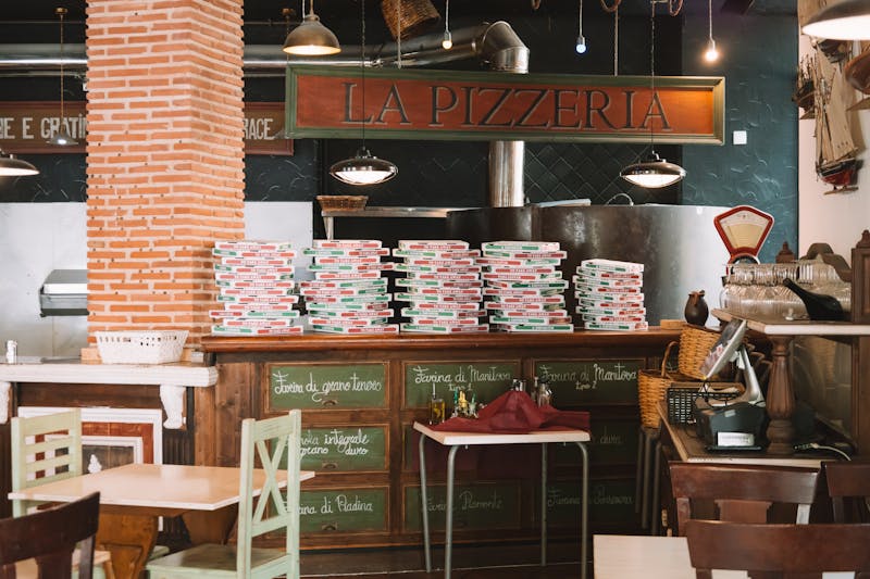 Dewey's pizza kitchen crafting handmade pizza with fresh ingredients